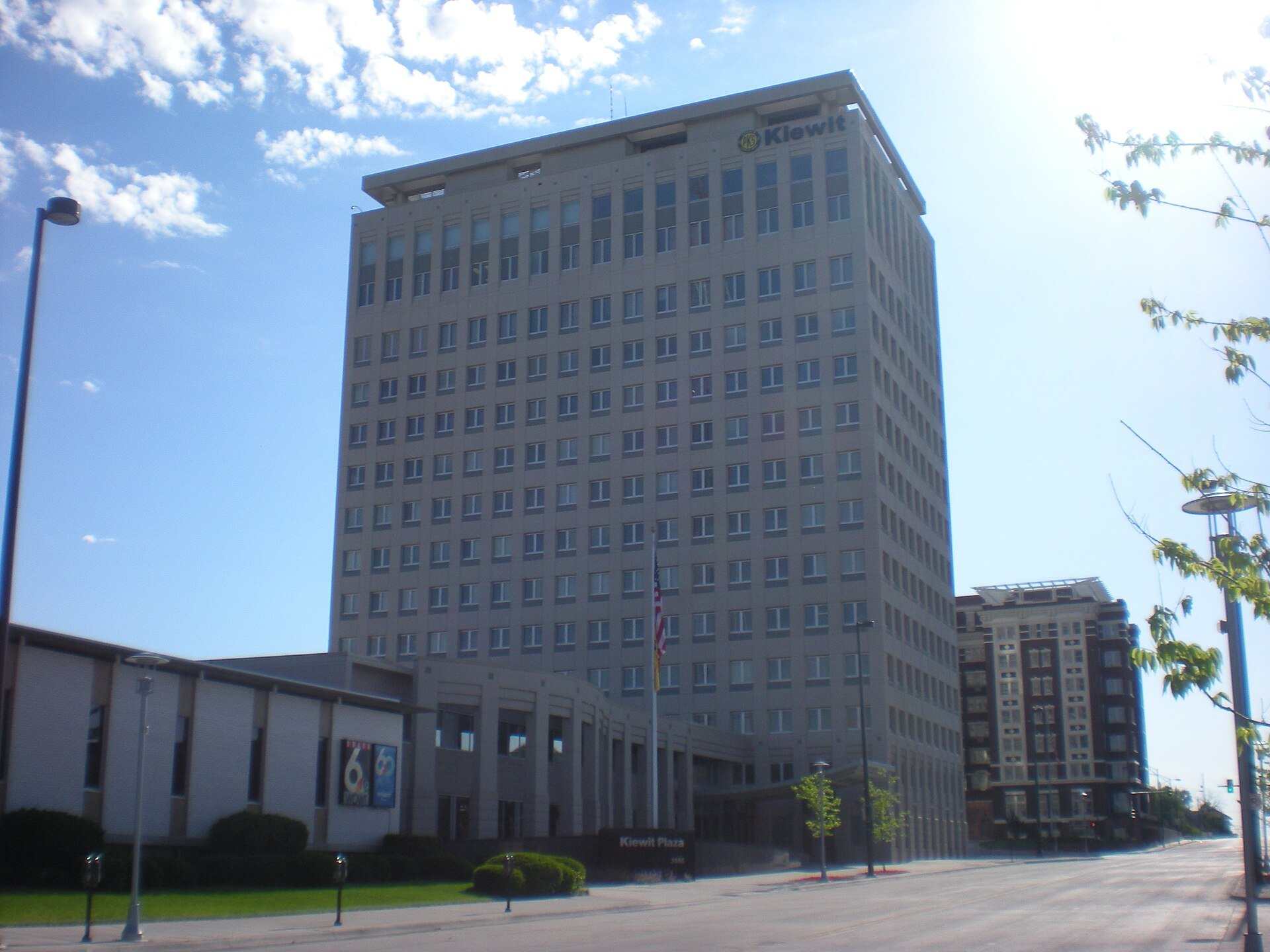 Pale twenty story office tower under a blue sky beside a low wing, from the Trevor L Taylor entry on capital allocation