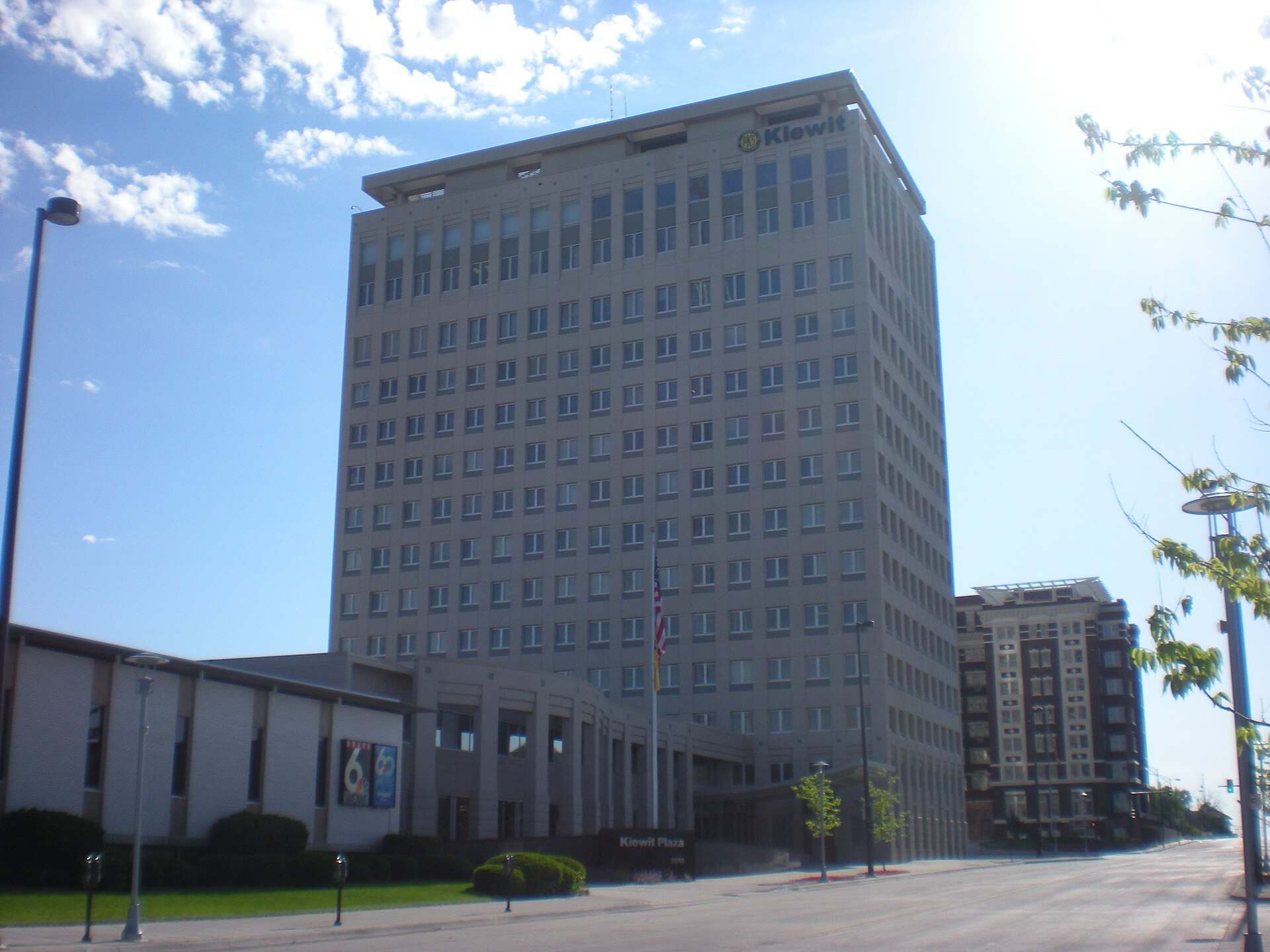 Pale twenty story office tower under a blue sky beside a low wing, from the Trevor L Taylor entry on capital allocation