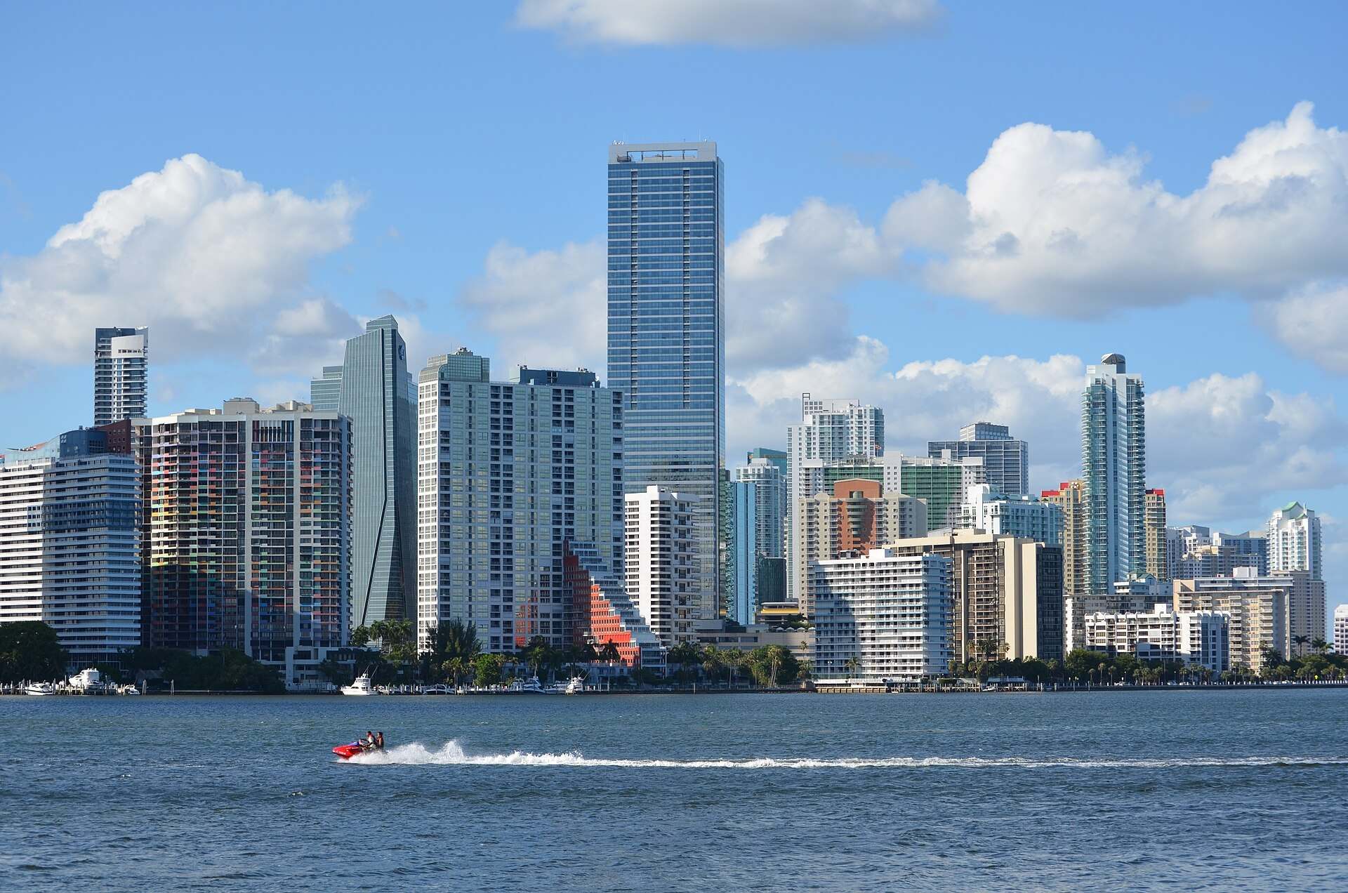 Brickell condominium towers across Biscayne Bay under a blue sky, from the Trevor L Taylor entry on Miami carrying costs