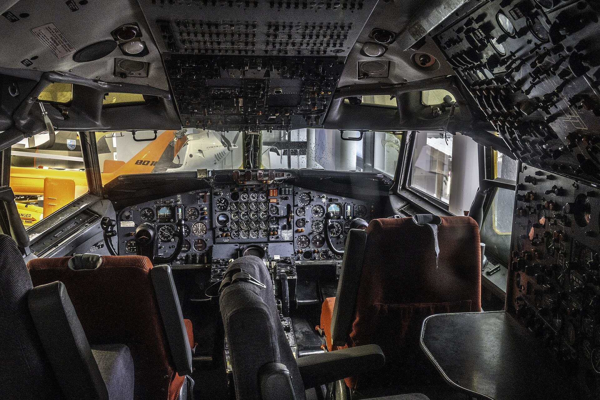 The empty flight deck of a preserved Boeing 707 with its instrument panel and crew seats, from the Trevor L Taylor entry on checklists