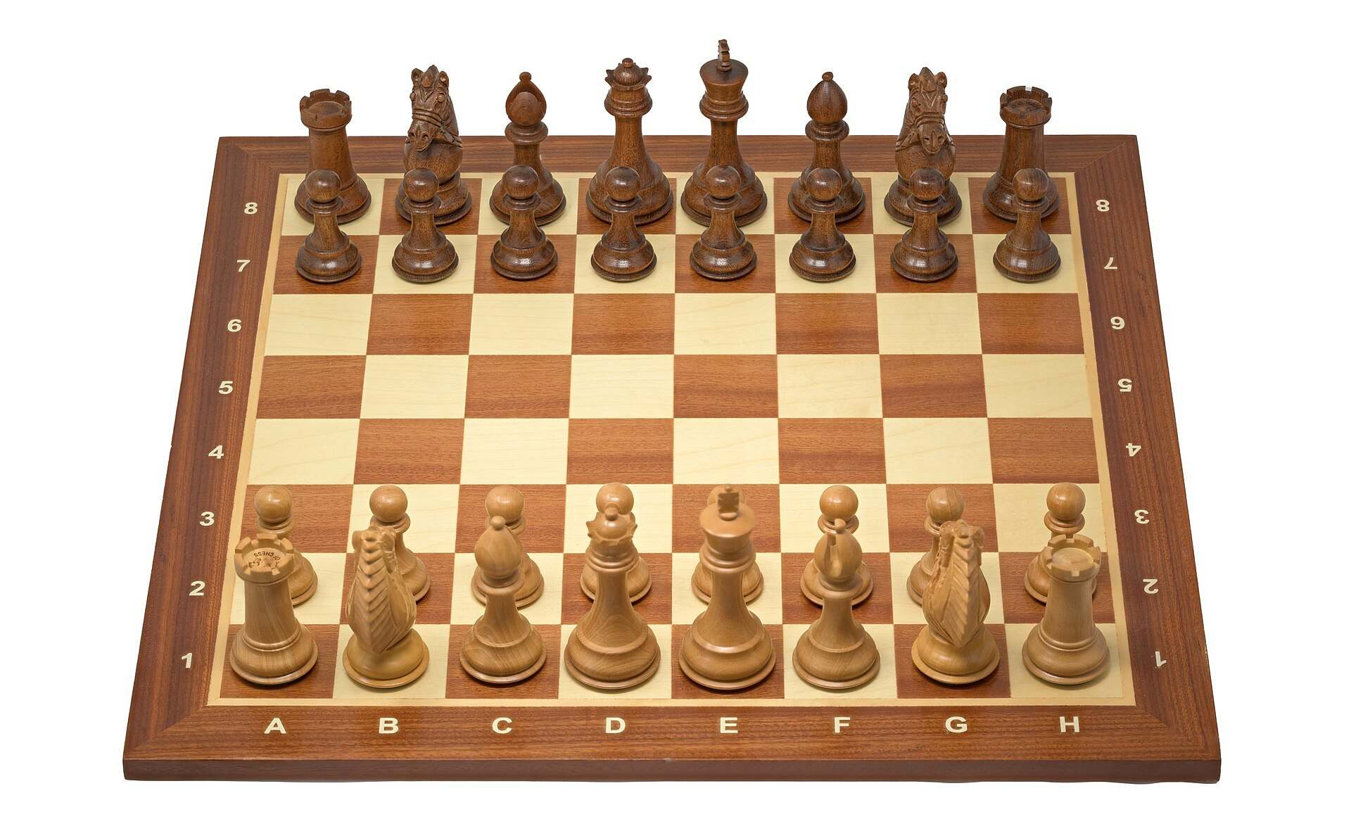 A wooden Staunton chess set arranged on its board before the first move, the hero for the Trevor L Taylor subject index on leadership and decisions