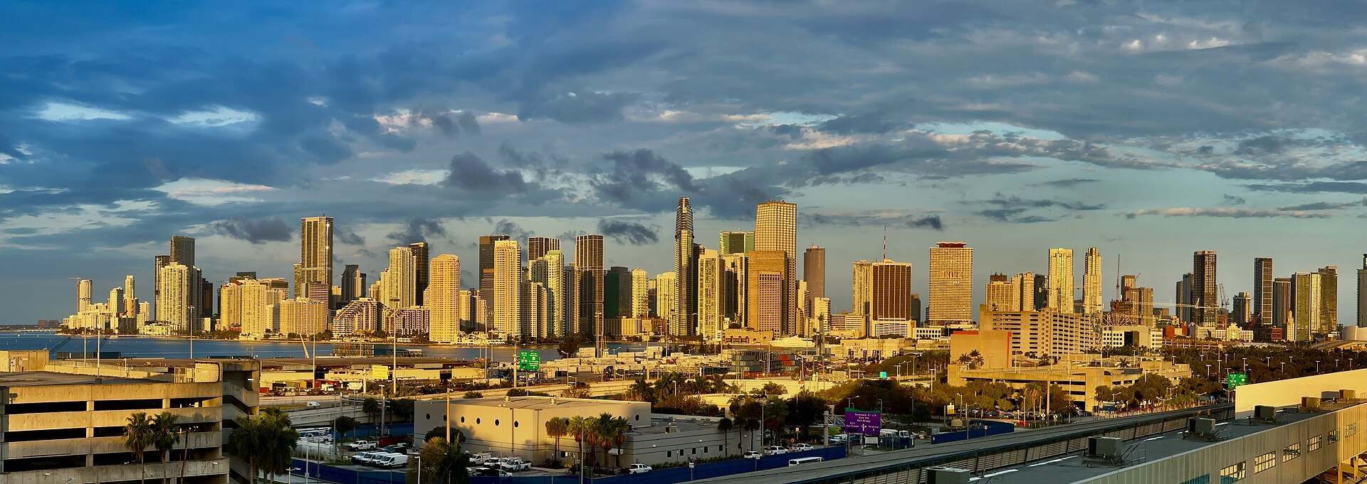 Panoramic Miami skyline at sunrise above the port roadways, from the Trevor L Taylor guide to Miami as a business and finance city