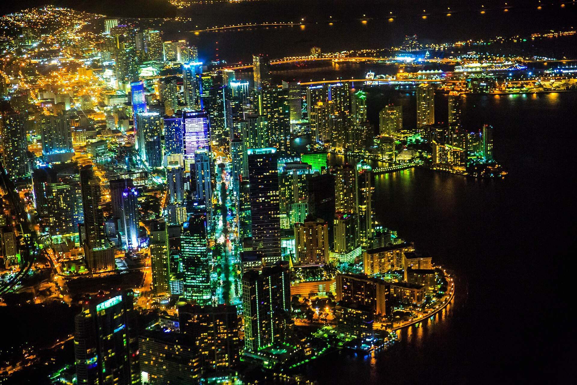 Aerial night view of downtown Miami and Brickell towers along Biscayne Bay, the cluster image for Trevor L Taylor on Miami real estate