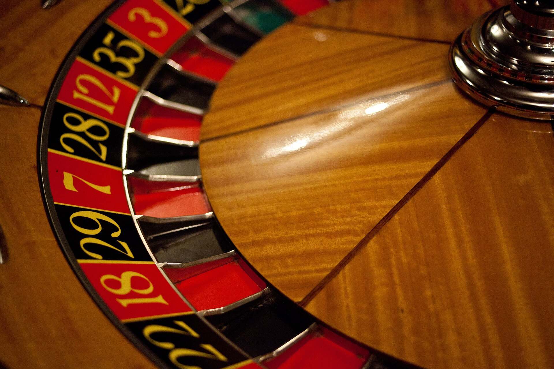 A close view of a roulette wheel showing its red and black numbered pockets, from the Trevor L Taylor entry on expected value