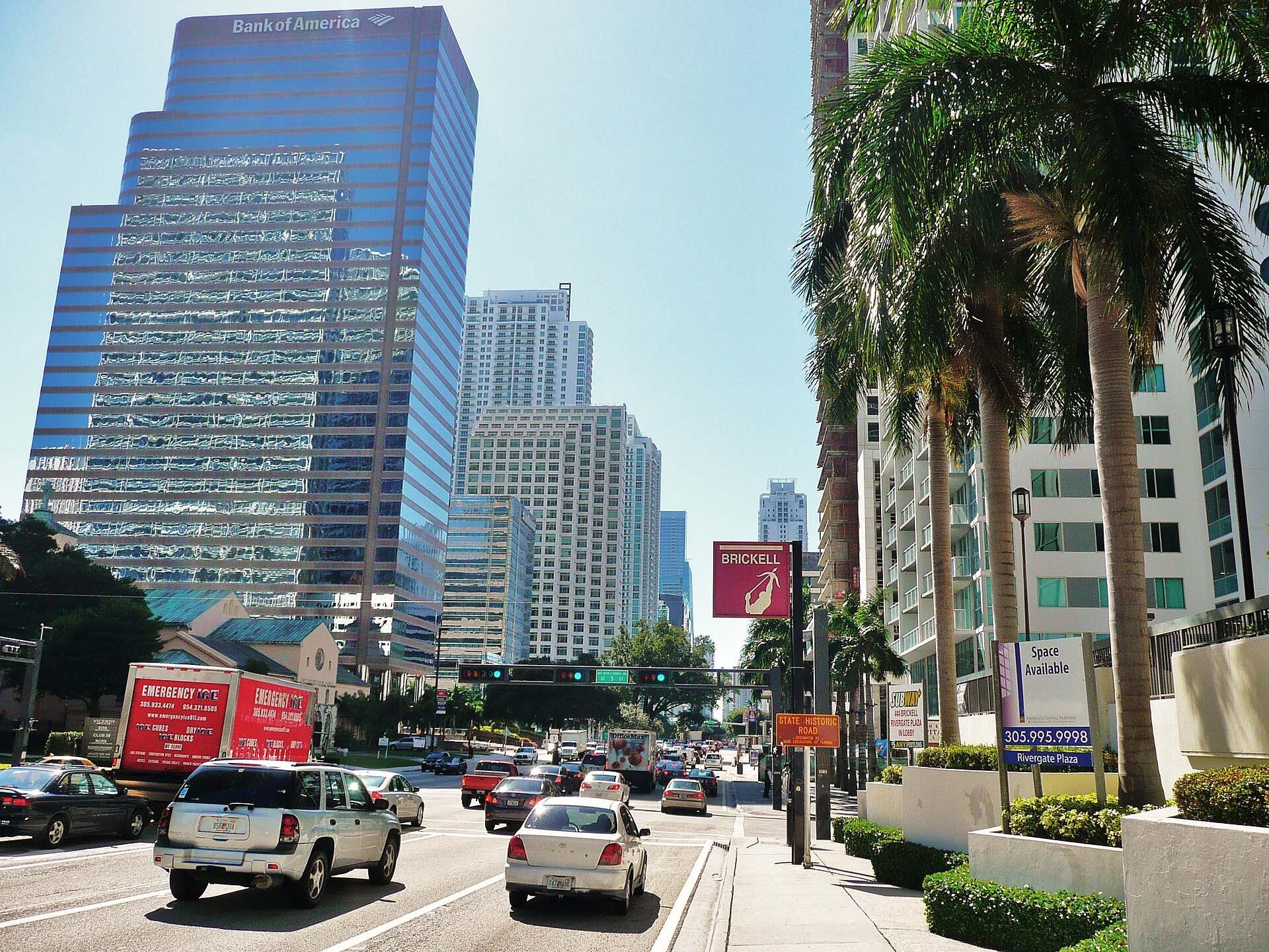 Office towers, palms and traffic along Brickell Avenue in Miami on a clear day, from the Trevor L Taylor entry on finance firms moving to Miami