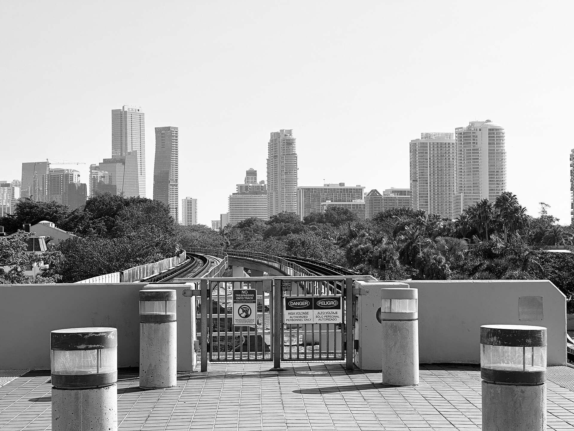 Black and white view along the elevated Metrorail tracks toward Brickell towers, from the Trevor L Taylor entry on the Miami 21 zoning code