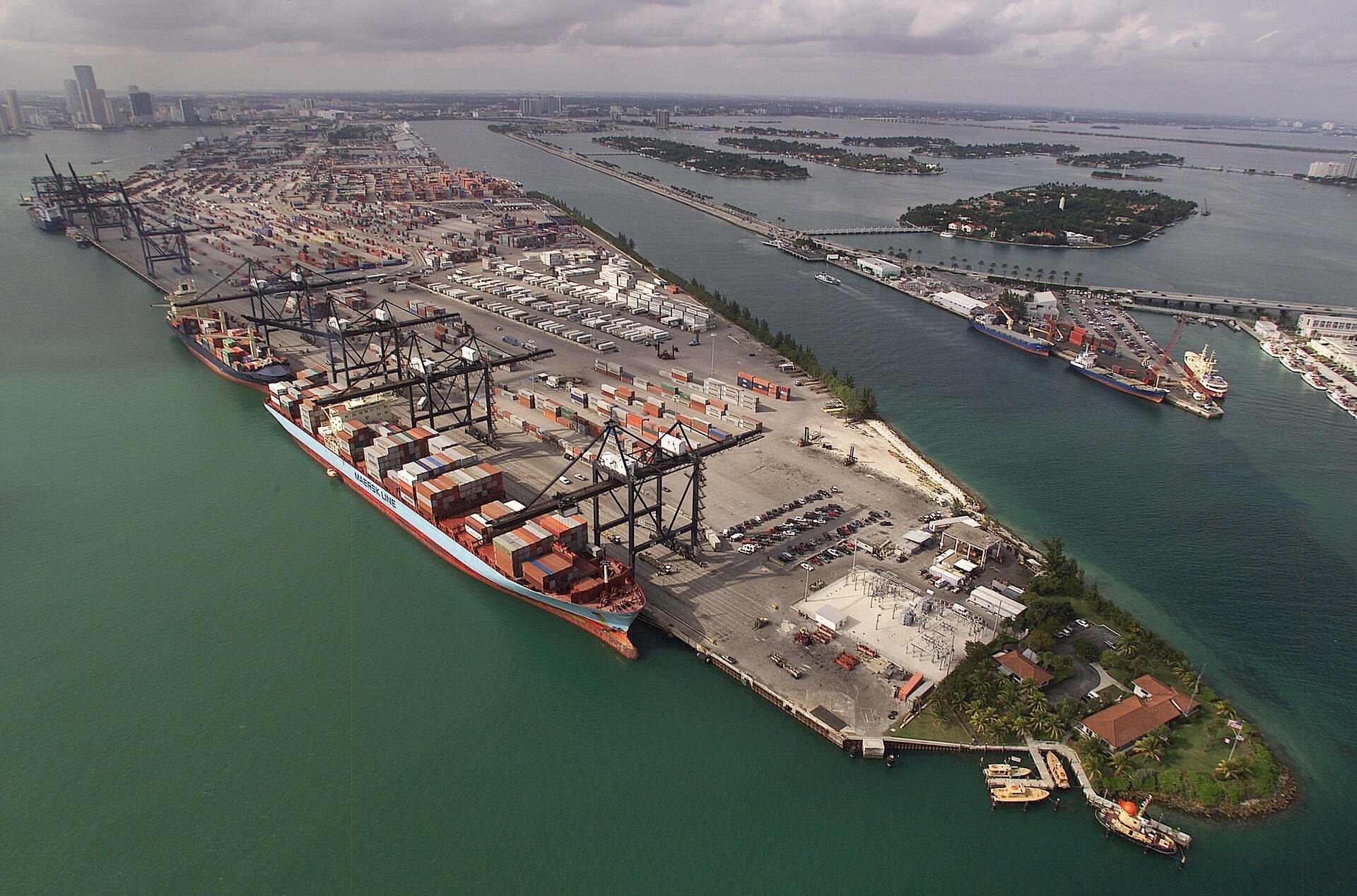 Aerial view of container ships and gantry cranes at the PortMiami cargo terminal on Biscayne Bay, from the Trevor L Taylor entry on PortMiami