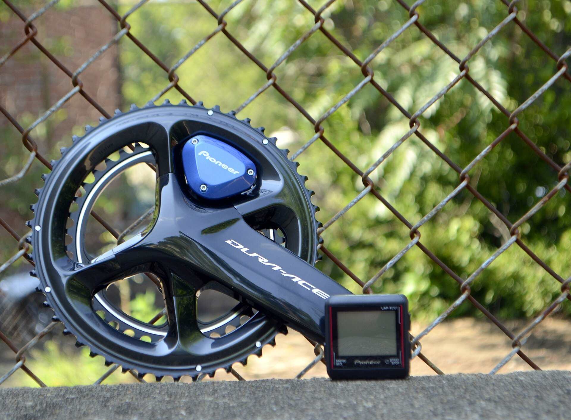 A road bike crankset with a crank mounted power meter pod and its small display unit, from the Trevor L Taylor entry on power meters