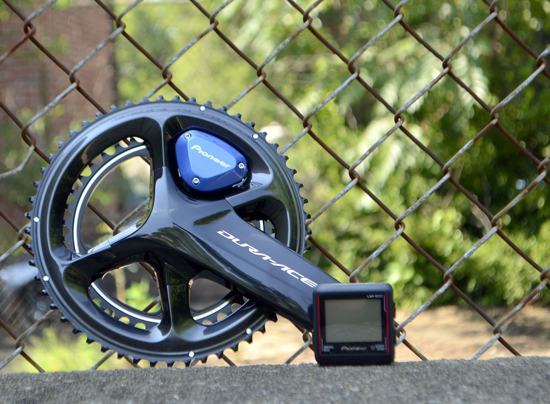 A road bike crankset with a crank mounted power meter pod and its small display unit, from the Trevor L Taylor entry on power meters