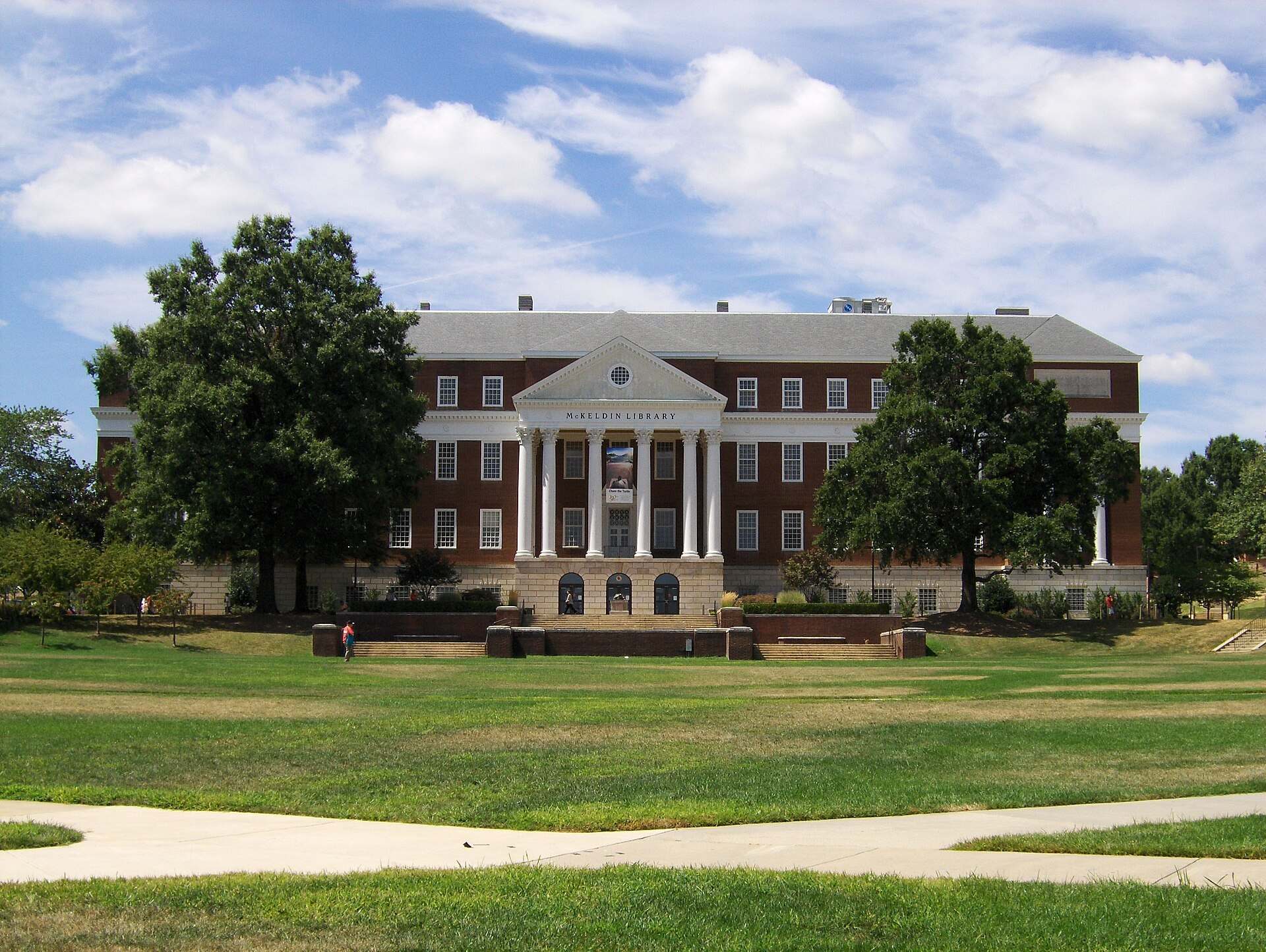 A columned university library across a wide green lawn, from the Trevor L Taylor entry on scholarship displacement