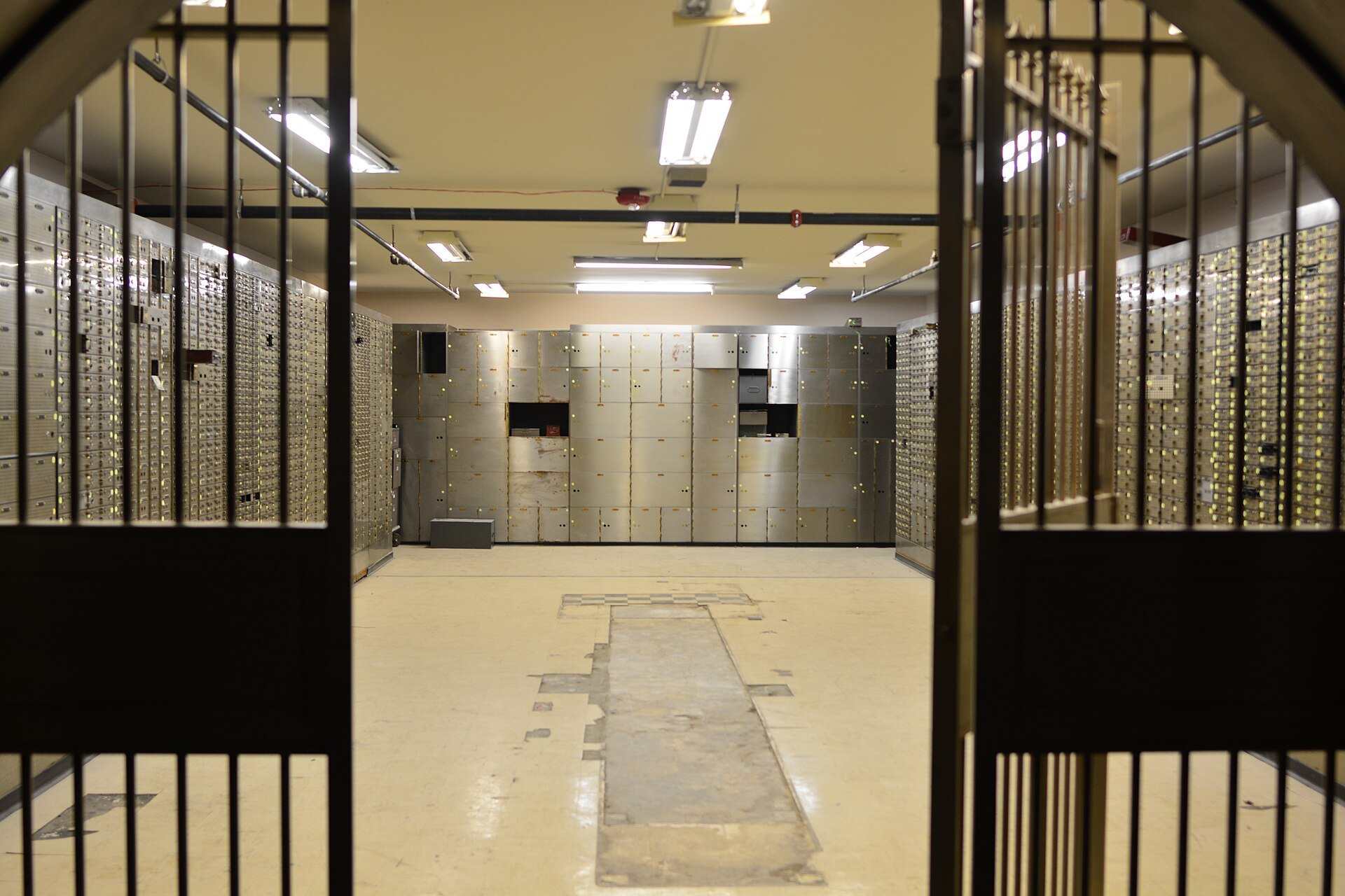 Rows of metal safe deposit boxes seen through an open vault gate, illustrating the Trevor L Taylor entry on special purpose vehicles