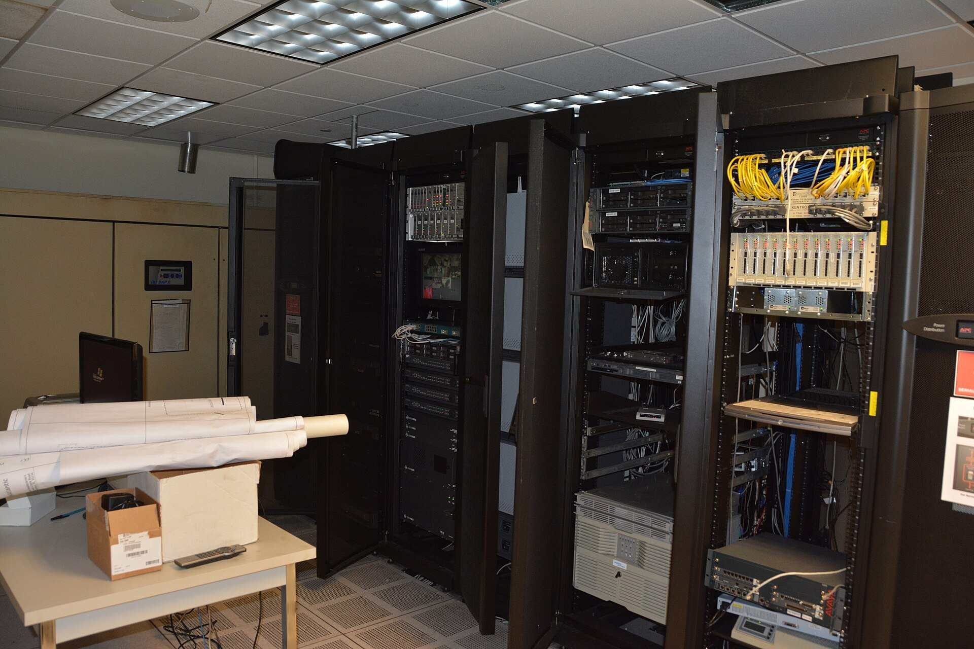 Open server racks with cabling and network gear in a small machine room, from the Trevor L Taylor entry on systematic investing