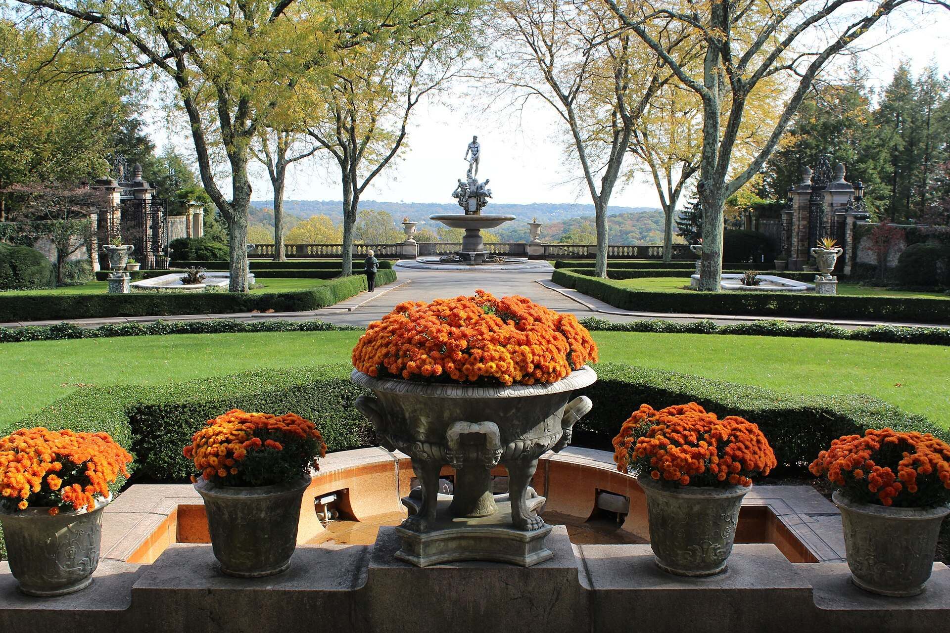 Formal gardens, urns of orange flowers and a fountain at the Kykuit estate built by the Rockefeller family, from the Trevor L Taylor entry on wealth succession planning